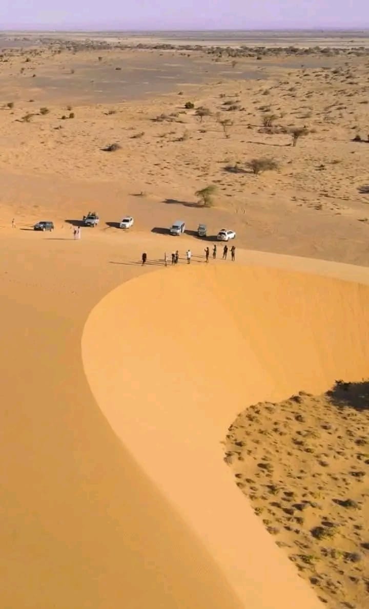 Visitors on a sand dune in Suguta Valley